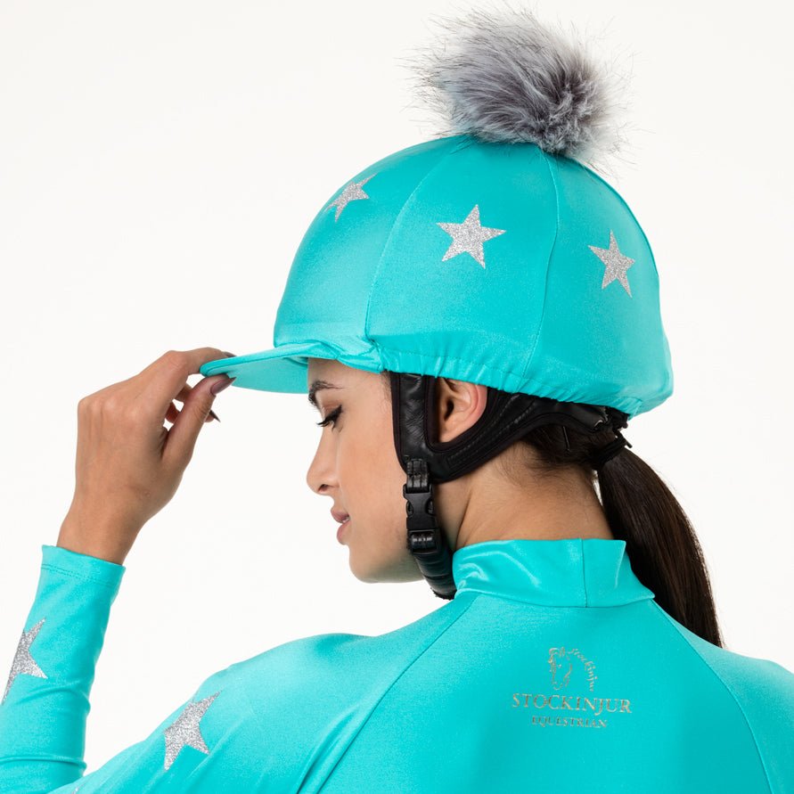 Turquoise matching pom pom riding hat silk and baselayer 
